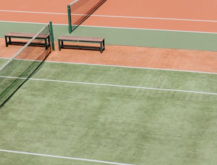 empty green and orange tennis fields