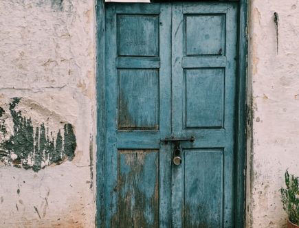 blue wooden 6-paneled door