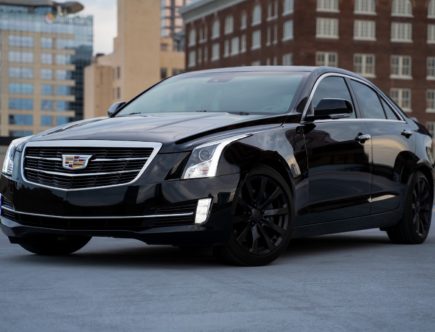 black mercedes benz c class parked on road during daytime